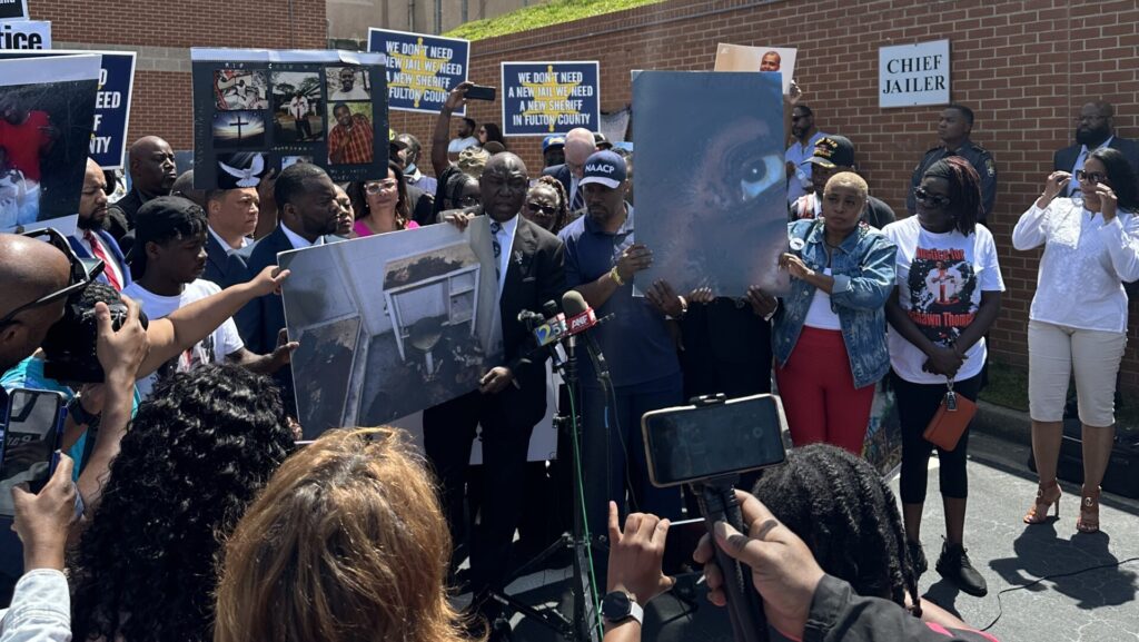 Attorneys for LaShawn Thompson’s family hold up photos of the filthy jail cell where he died, and a close-up of his eye, covered in bugs: “If you don’t see, you don’t care.”
