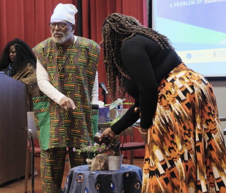 Tiffany Williams Roberts pours a libation to open the UN EMLER Convening.